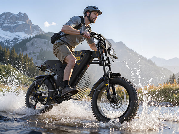 Man wearing red shorts and helmet riding black and blue mountain bike on rocky terrain outdoors