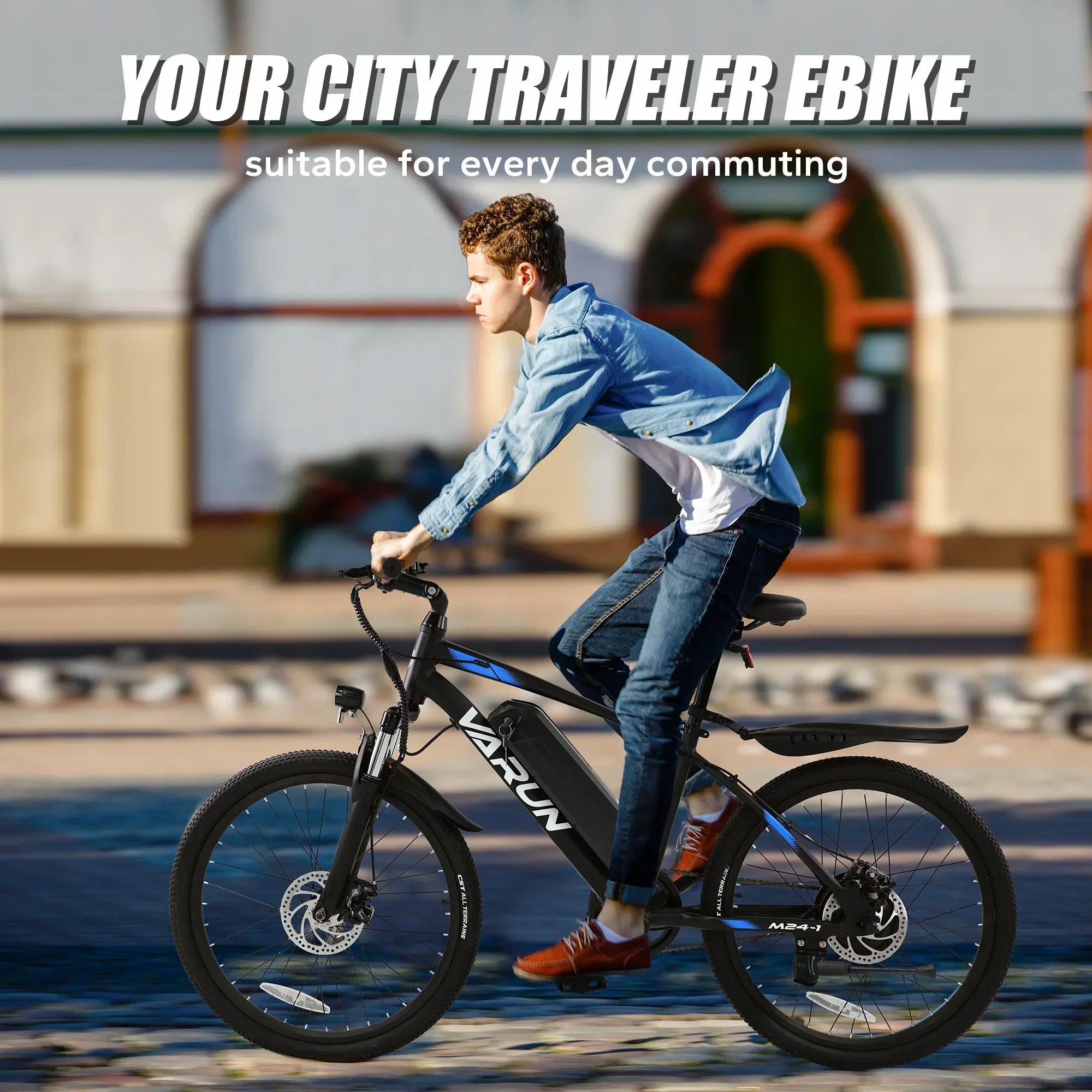 Young man riding black Varun city traveler electric bike outdoors in urban setting