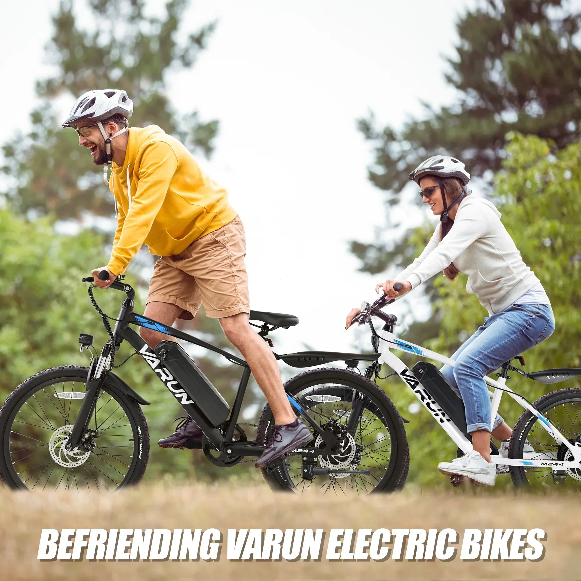 Man and woman riding Varun electric bikes outdoors wearing helmets and casual clothes