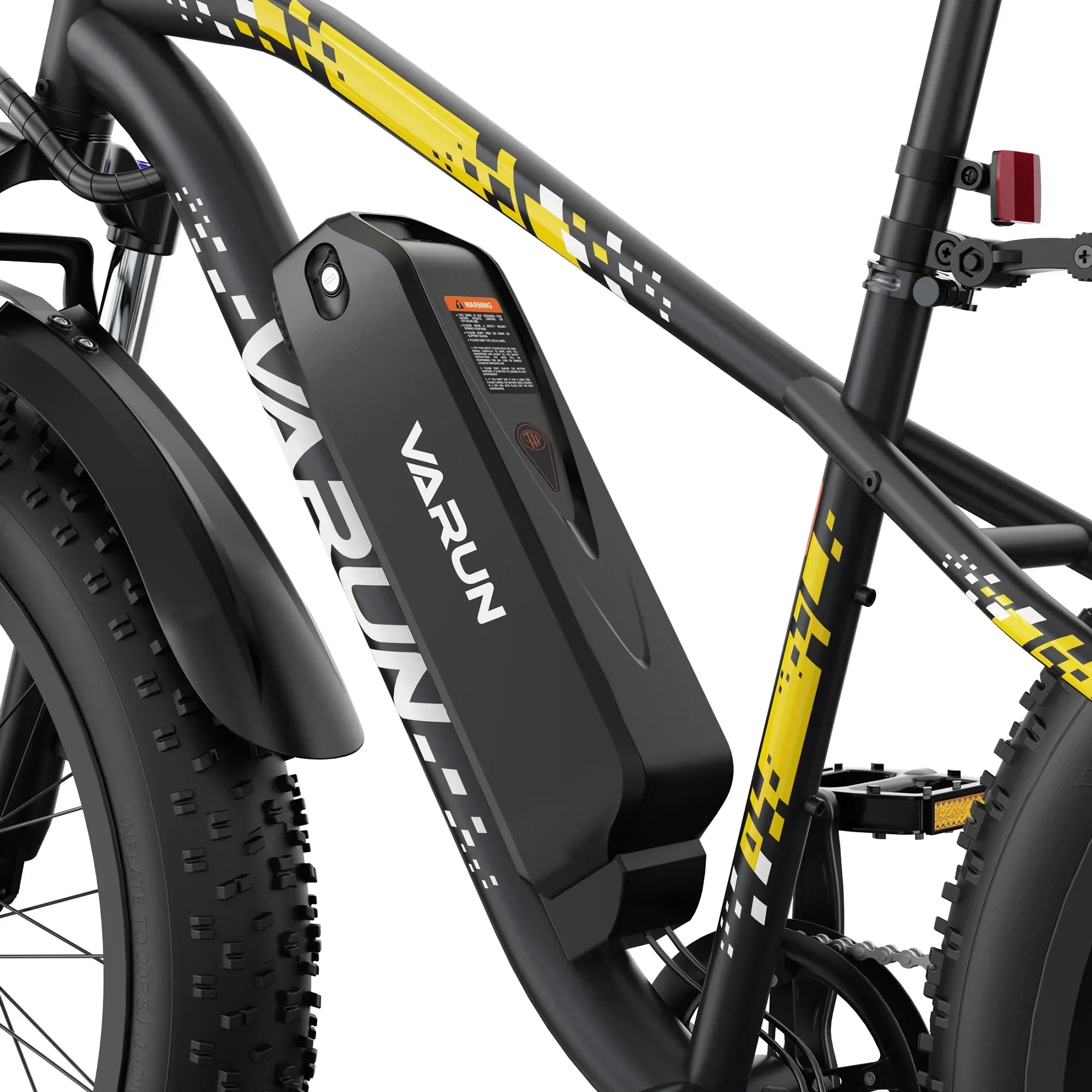 Close-up of black and yellow Varun electric bike frame featuring a mounted battery pack and thick knobby tires