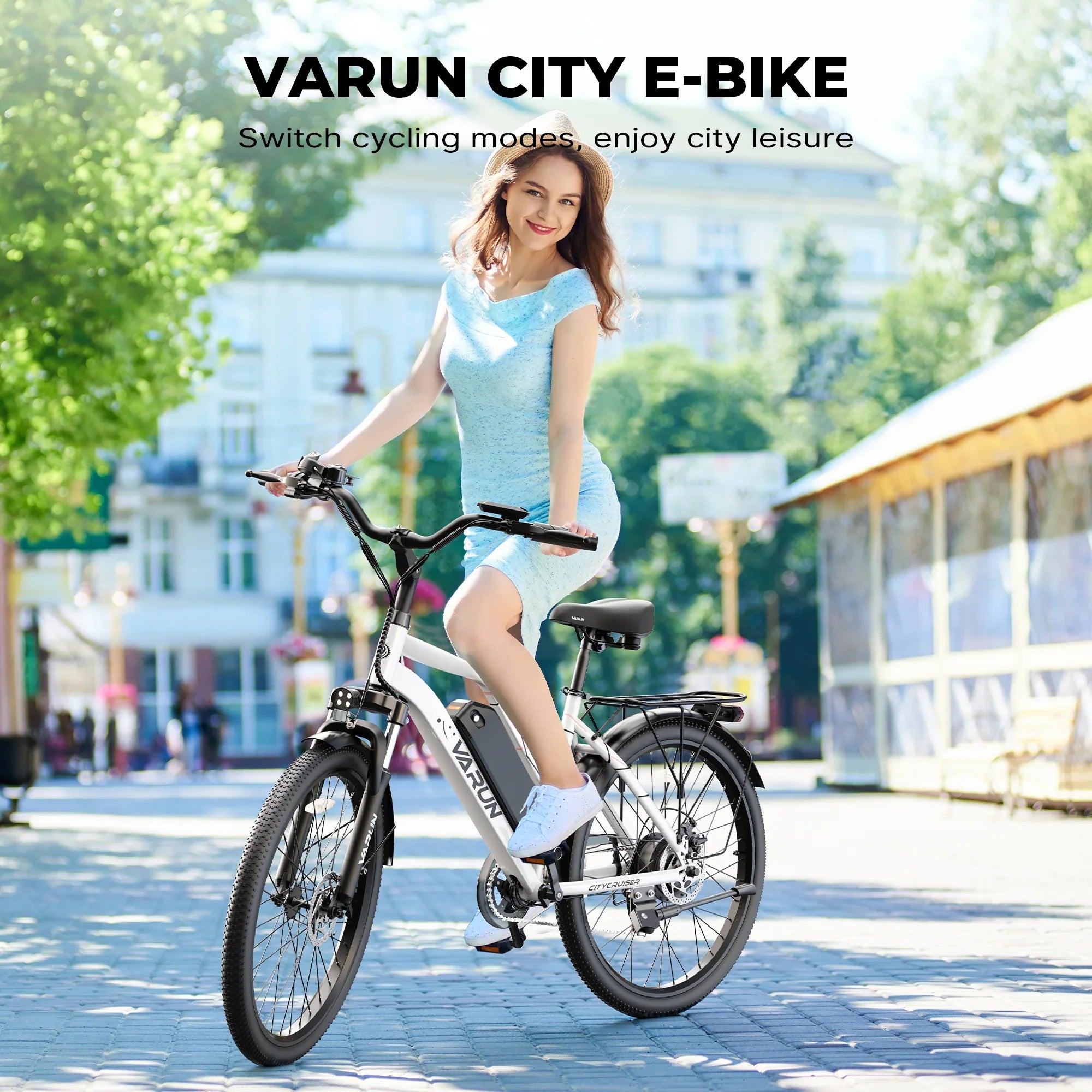 Young woman in blue dress sitting on white Varun city electric bike on a sunny urban street