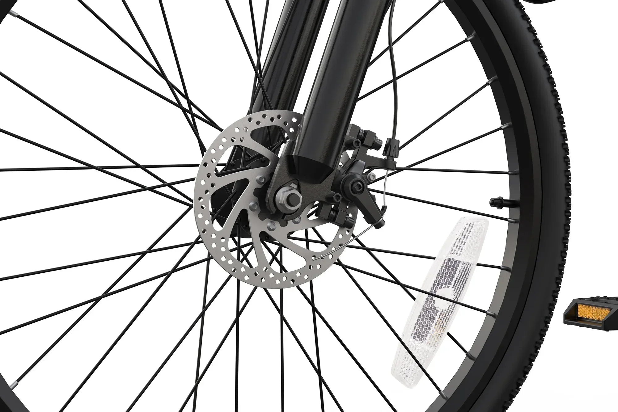 Close-up of black bike front wheel with disc brake and white reflector on spokes