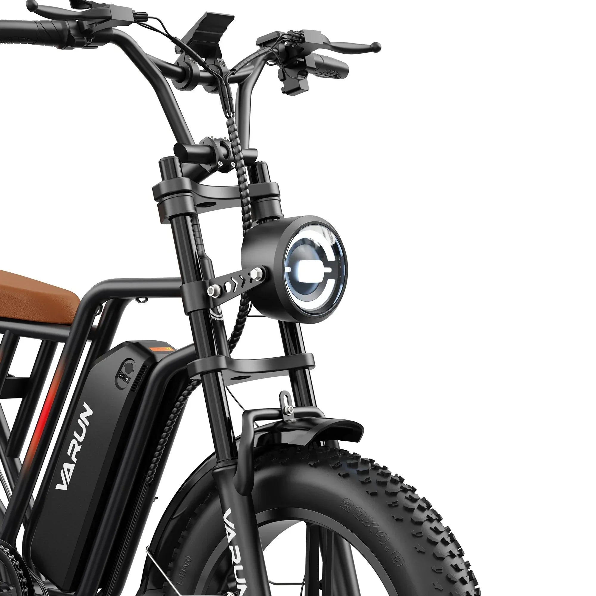 Close-up of black Varun mountain e-bike front with LED headlight and thick off-road tires