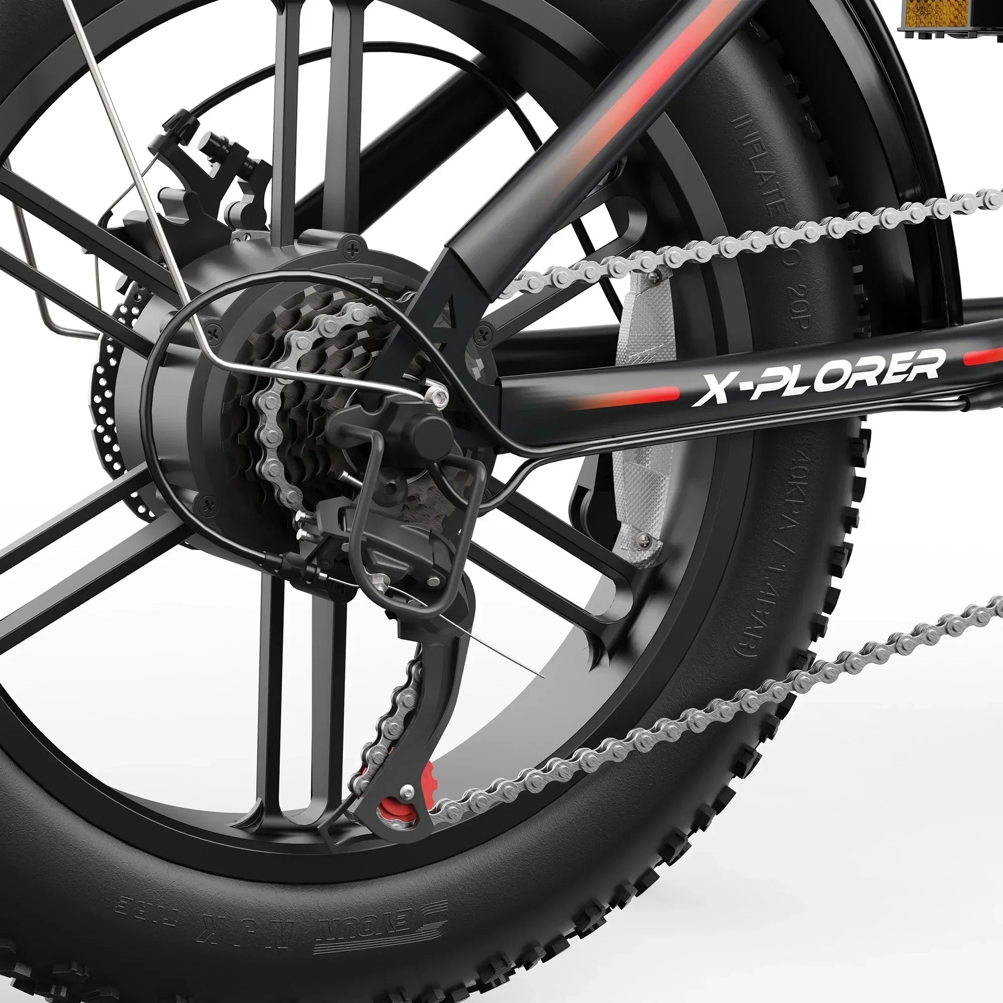 Close-up of black X-Plorer fat tire electric mountain bike rear wheel with chain and gears