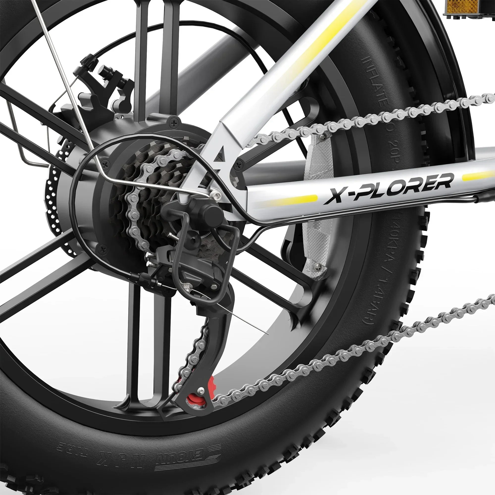 Close-up of X-PLORER mountain ebike rear wheel, thick tire, gear cassette, and chain on silver frame