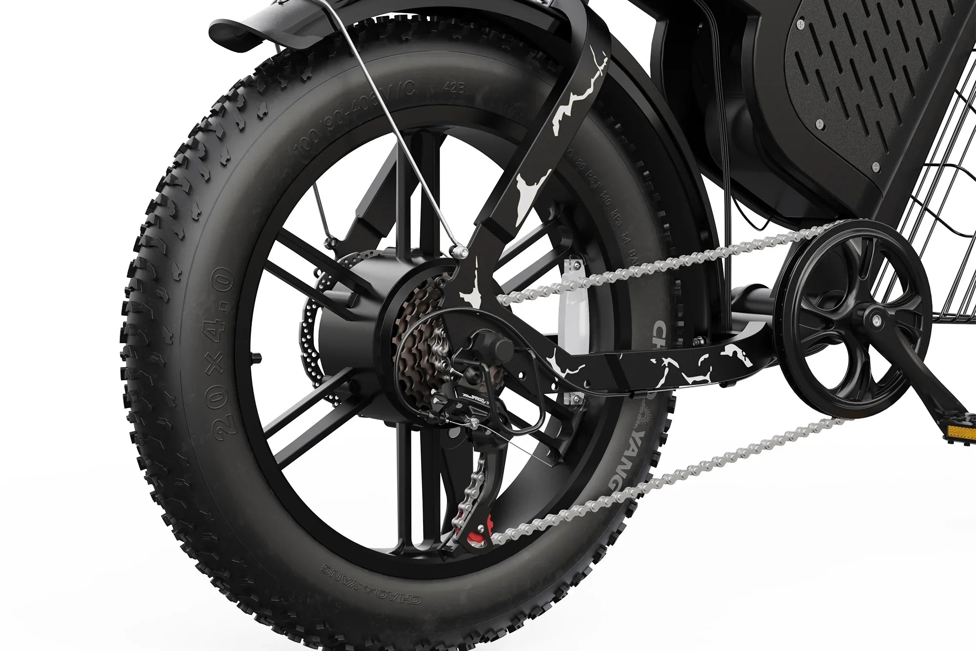 Close-up of a black fat tire electric motocross bike rear wheel with white camo accents and gear cassette