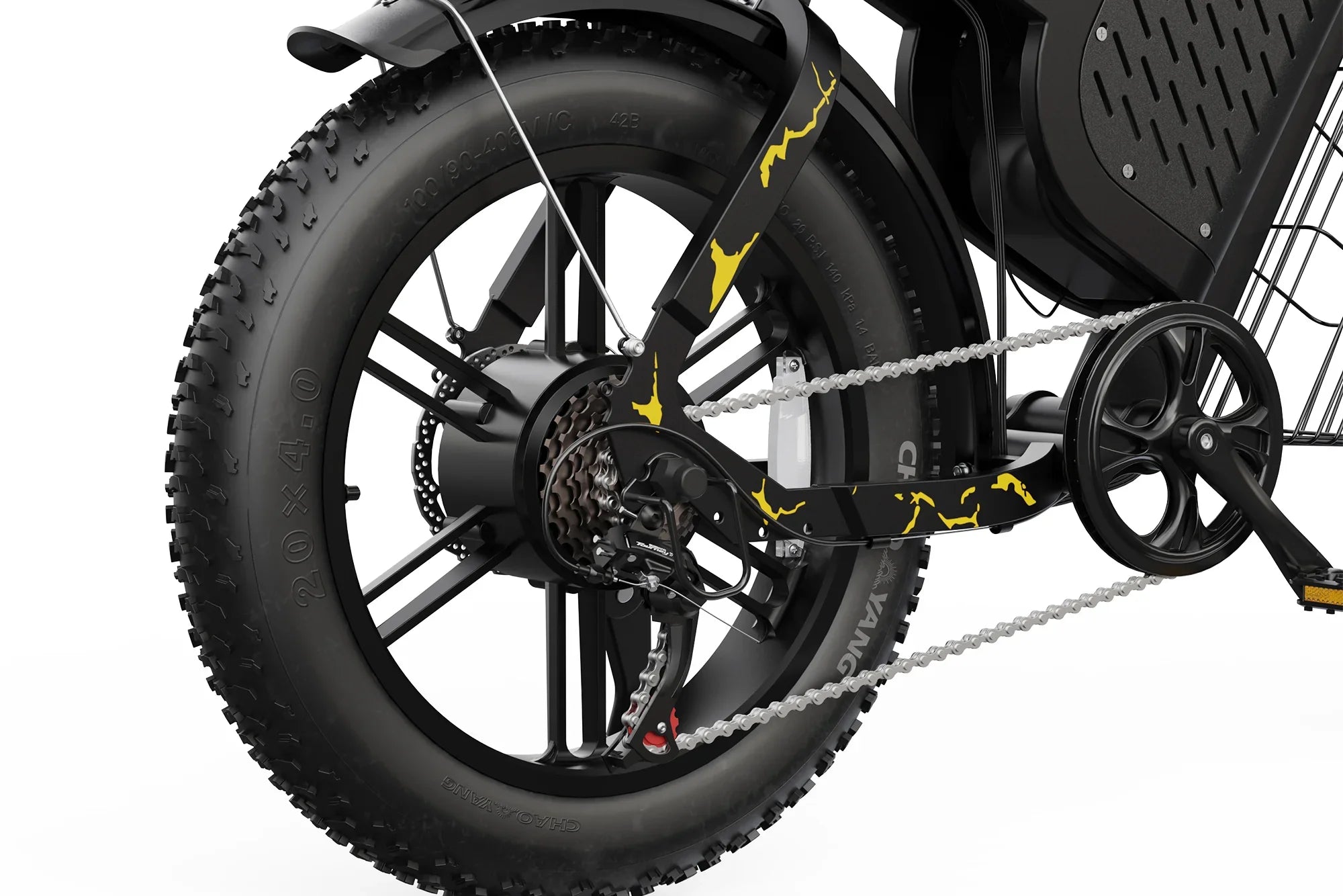 Close-up of electric motocross bike rear wheel with fat tire, black frame, yellow camo pattern, and gear cassette