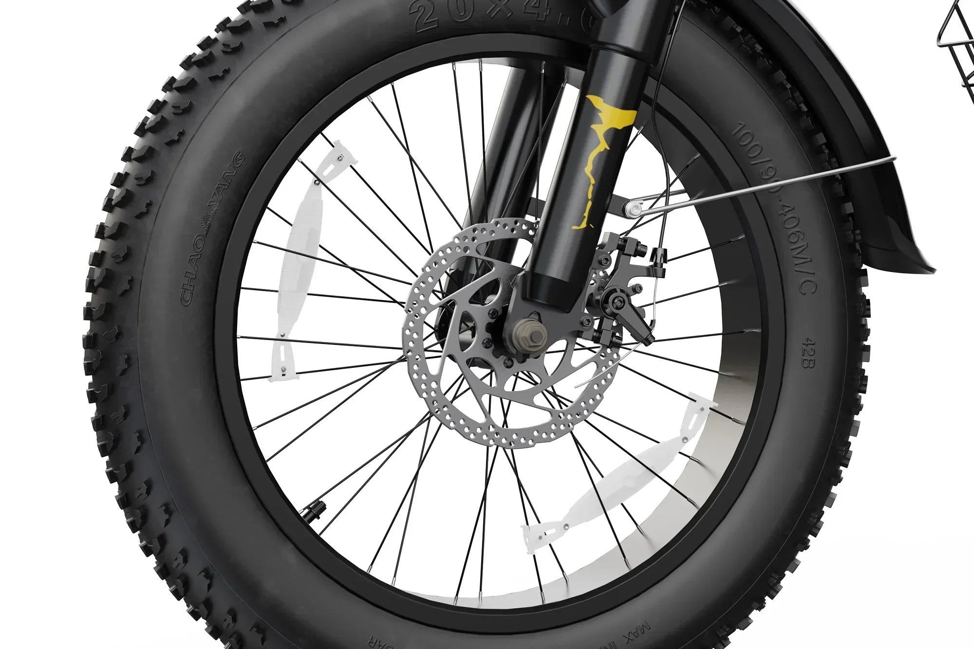 Close-up of black fat tire with disc brake and suspension fork on electric dirt bike