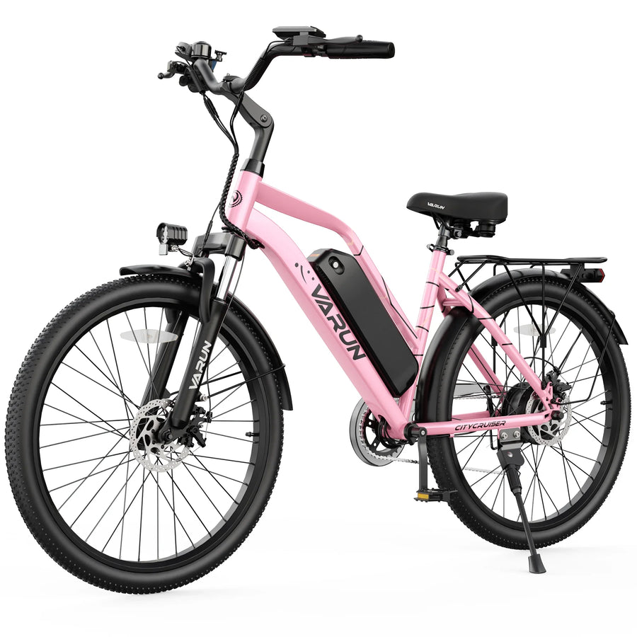 Pink Varun City Cruiser electric bike with black battery, front light, and rear rack